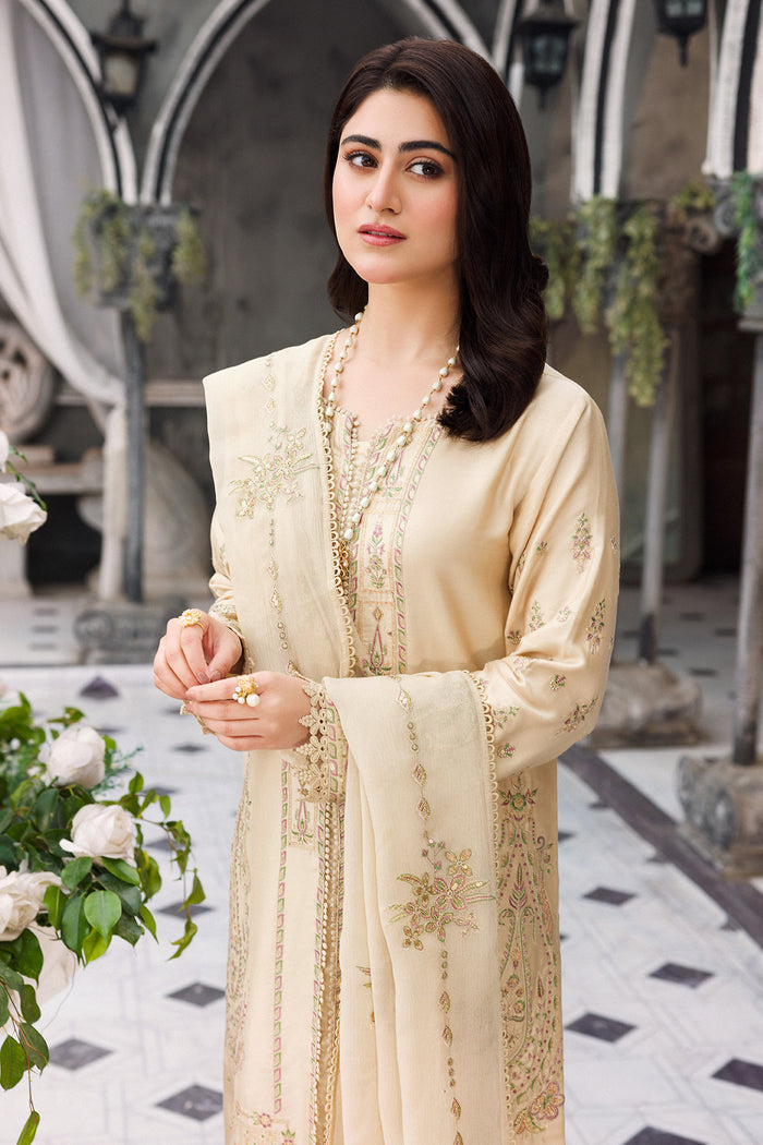 Mid view showing lace hem and tassel finish on embroidered shirt border
