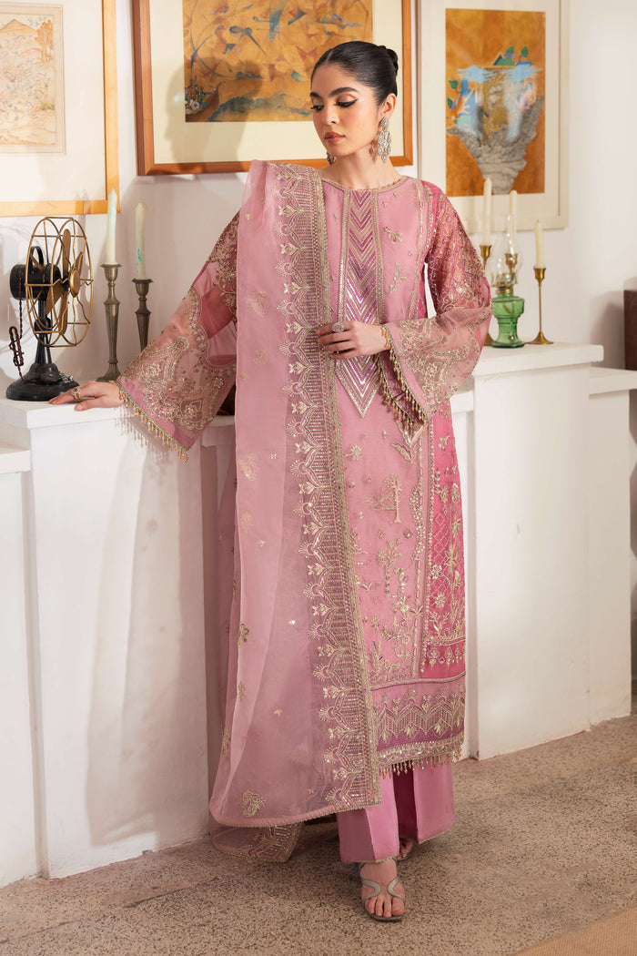 Model wearing full NAQSHI Nayab 3PC set: pastel & berry-pink organza shirt with embroidered panels, straight culottes, crystal sleeve hangings & embroidered dupatta.