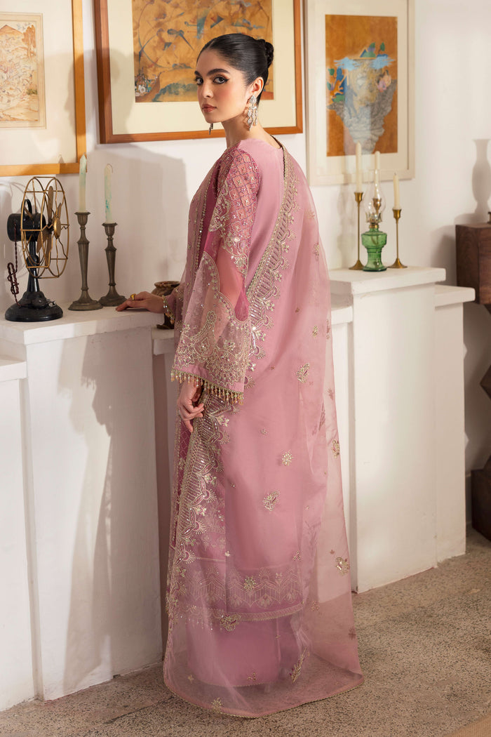 Back view of NAQSHI Nayab organza shirt featuring embroidered chunky hem border, crystal hangings on back yoke, and straight culottes peeking.