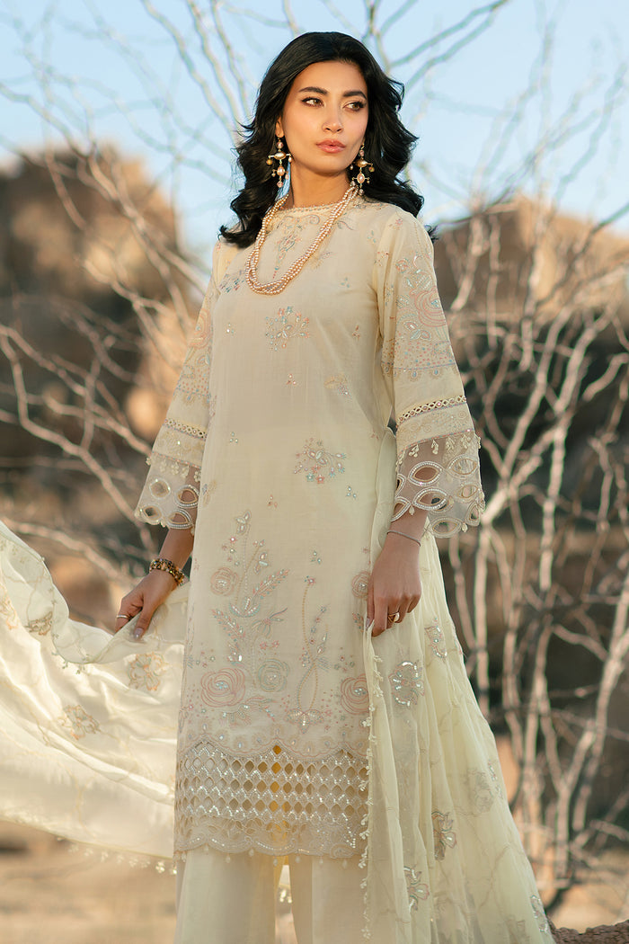 Walking pose of Nazakat light yellow 3 piece suit showing balanced long shirt and straight trousers