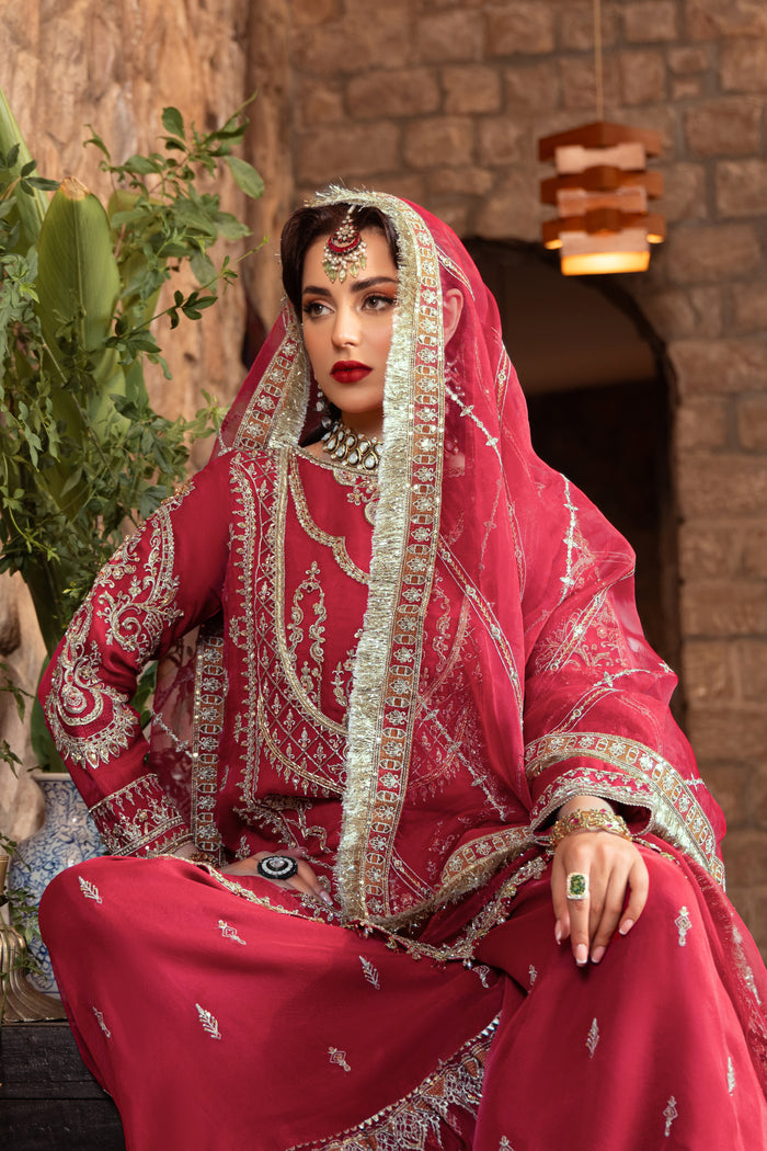Close-up of naqshi nehal dupatta edge showing dense embroidery, applique details, kiran lace, and ornate sequin border on net.