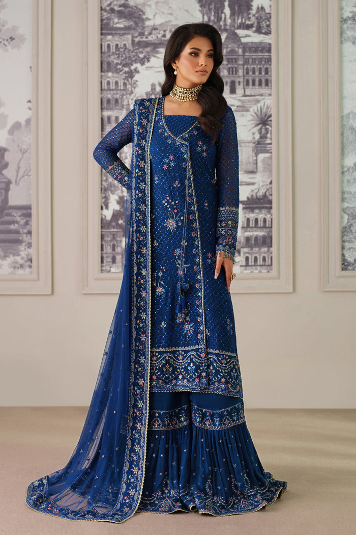 Nia by NAQSHI full front view in navy blue crinkle chiffon with embroidered shirt, voluminous sharara, and delicate tassel hangings