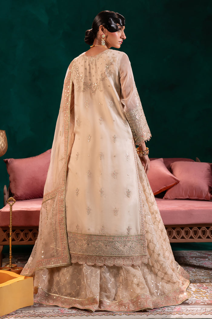 Macro of Naqshi Nigaar shirt back highlighting heavy multi‑head hand‑adda embroidery, sheet work, lace appliqué and scalloped border with crystal drops.