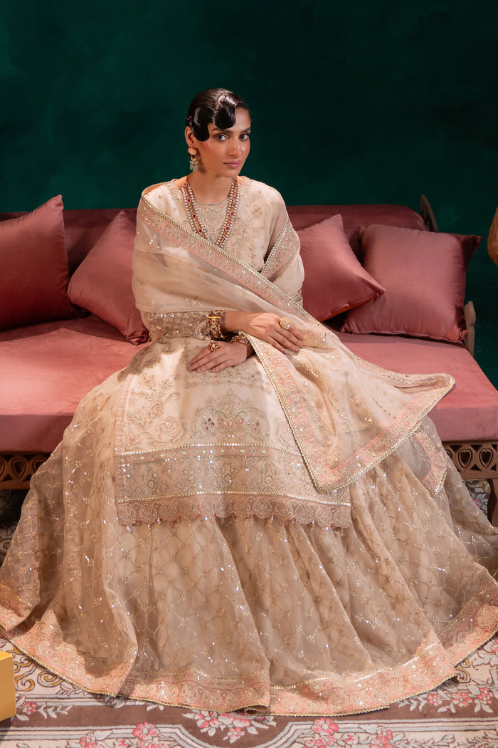 Macro of Naqshi Nigaar lehenga hem featuring sequin-and-thread embroidered scalloped border matching the shirt details.