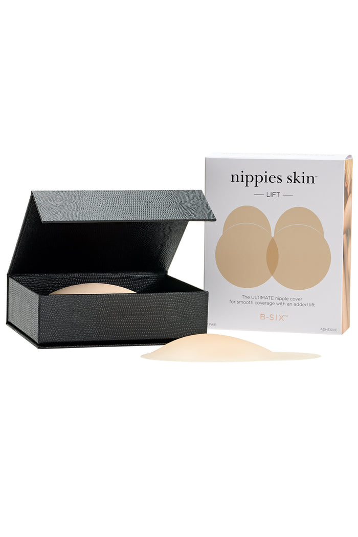 Front view of Nippies Skin Lift silicone nipple cover and package showing domed adhesive lift and included black storage case