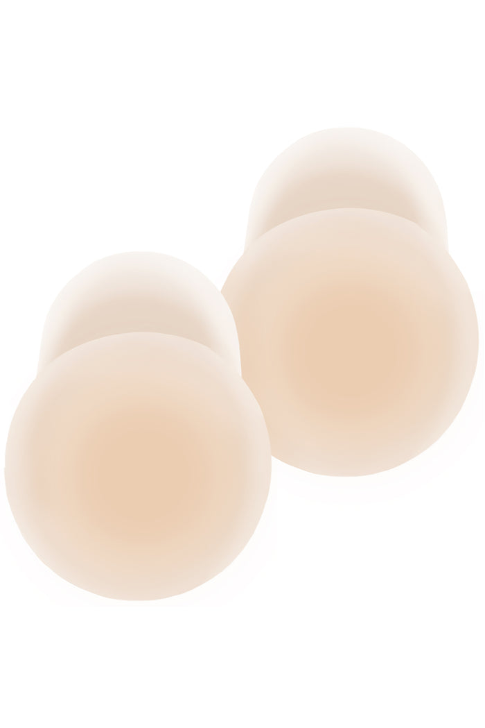 Top view of Nippies Skin Lift silicone nipple covers showing adhesive lift design in creme on white background
