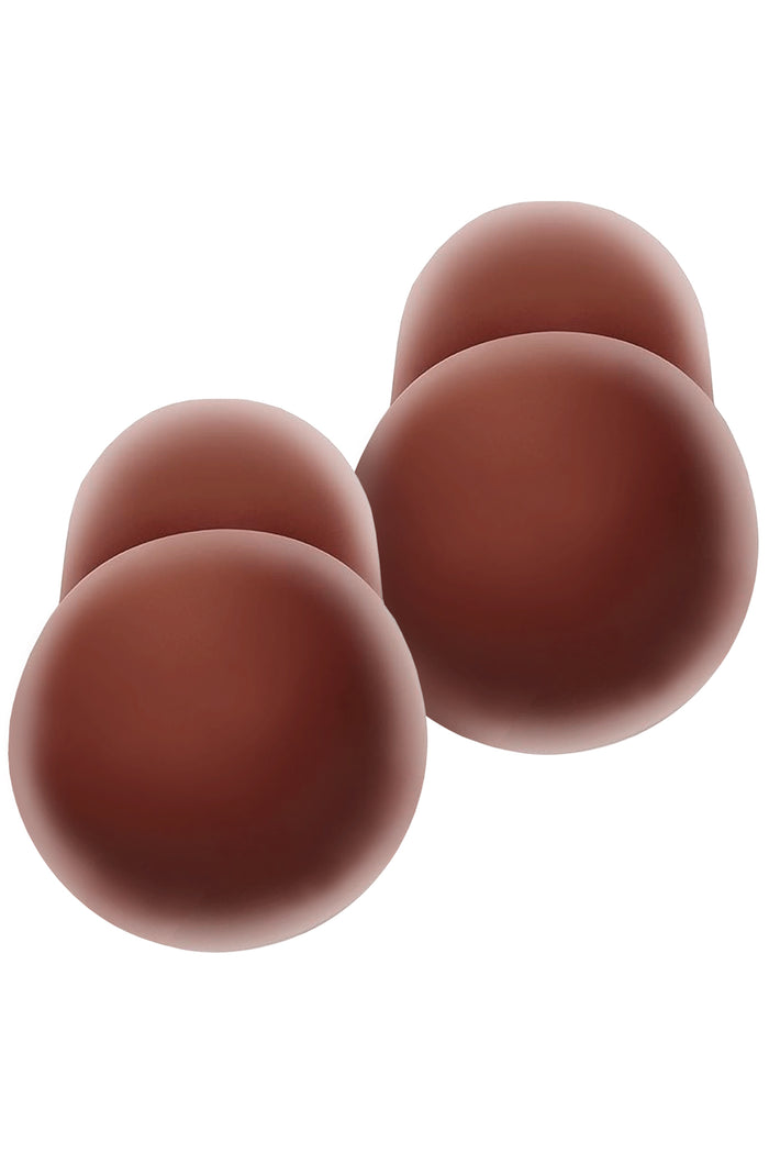 Front view of Nippies Skin Lift silicone nipple covers in Hazelnut, two pairs showing rounded dome shape on white background