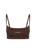 Brown cropped bralette with thin adjustable straps and MONDAY printed centered on front.