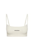 Ivory crop bra with thin adjustable straps and MONDAY embroidered at center front.