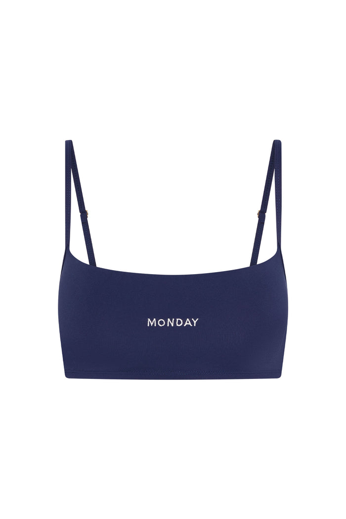 Front view of Olympic Bra in Midnight Jersey with embroidered MONDAY logo and adjustable thin shoulder straps on white background
