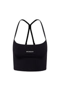 Black cropped tank top with thin crossed back straps, 'MONDAY' embroidered on front.
