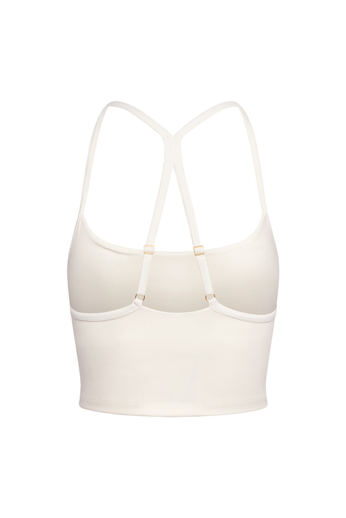 Back view of Olympic Tank in ivory showcasing racerback straps with adjustable gold-tone sliders on white background
