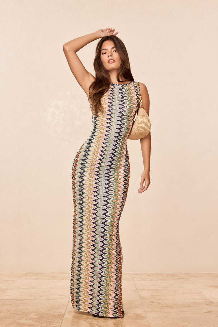Front view of Oslo Dress in Porto Cervo Multi showcasing multicolor zigzag knit and bodycon fit on model with beige studio background