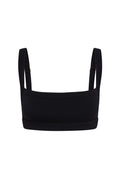 Front view of Outpost Bra in black showcasing square neckline, wide adjustable straps, and contoured underband on white background