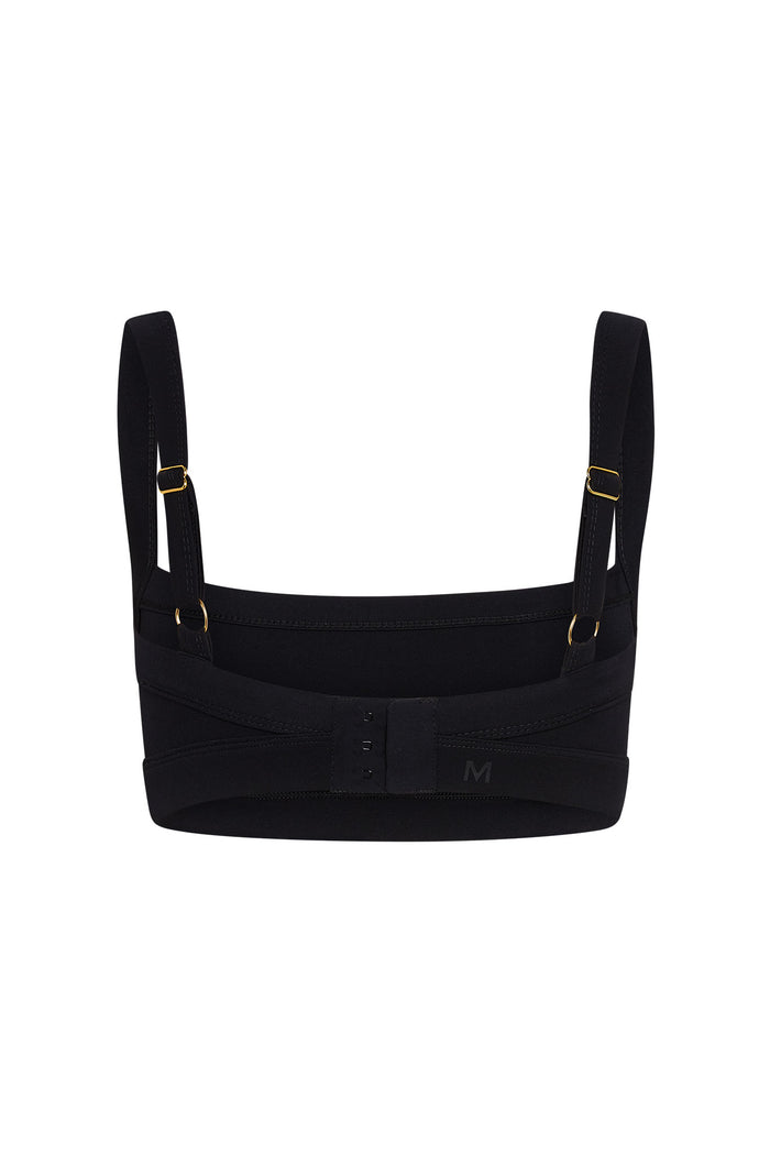 Black supportive bra back with adjustable straps, gold hardware, three-row hook-and-eye closure, M logo.