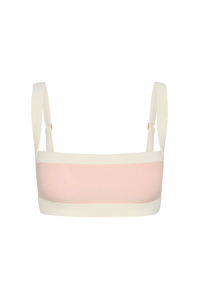Back view of Outpost Bra in Heather Powder Pink/Ivory showcasing straight back band and adjustable ivory straps