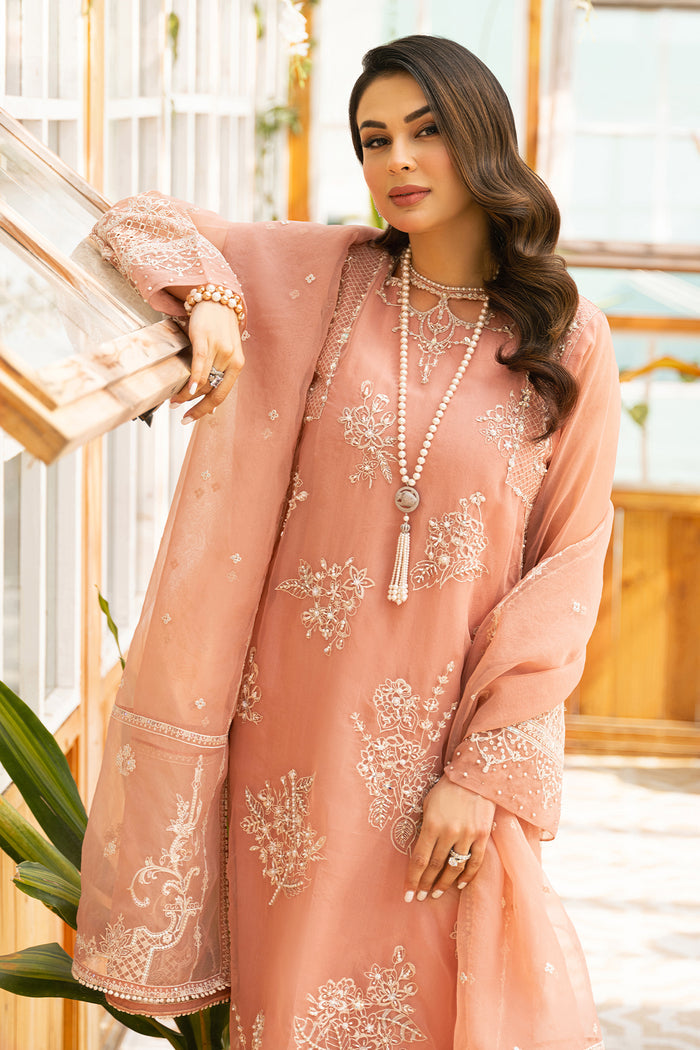 Side portrait of Ovate peach formal dress showing sleeve borders and dupatta movement, ready to wear occasion wear.