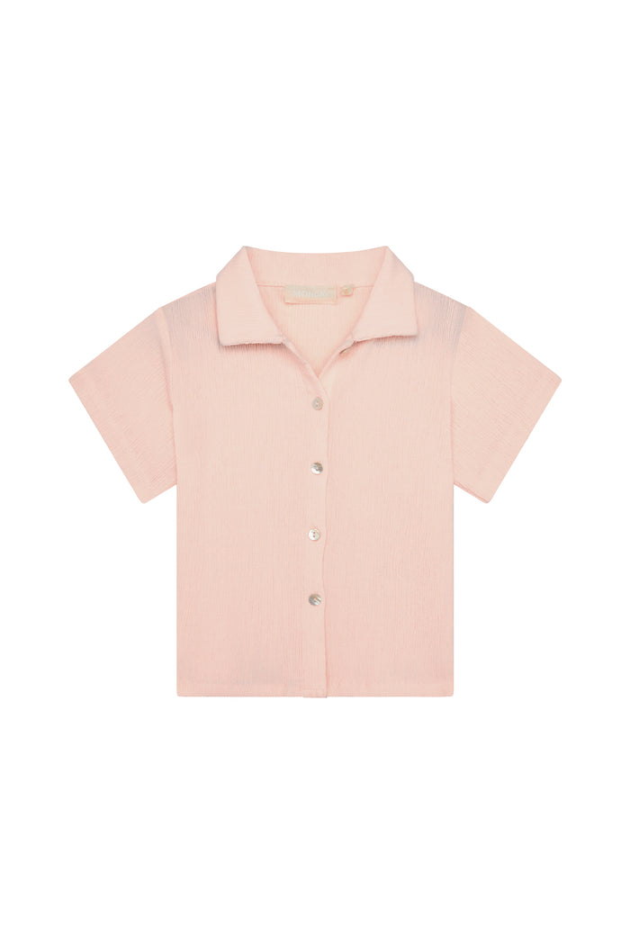 Front flat lay of Pacific Beach Shirt Kids showcasing powder pink crinkle texture, short sleeves and button-front on white background