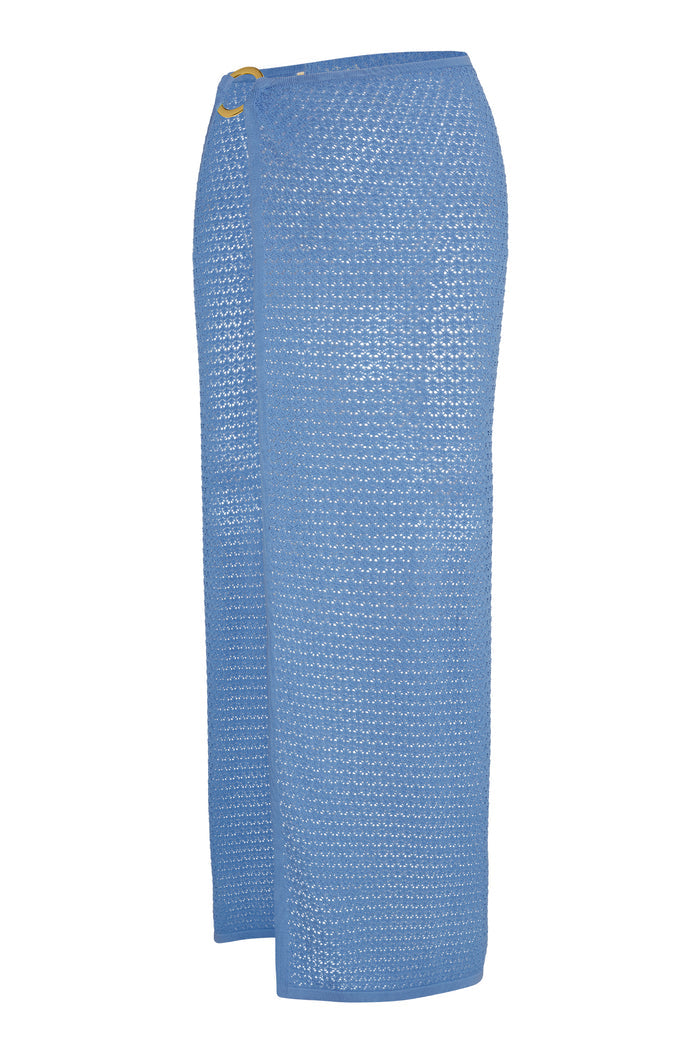 Blue ankle-length crochet knit wrap skirt with sheer textured pattern and gold ring buckle at the waist