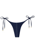 Front view of Palma Bottom tie-side bikini in blue denim with center seam and adjustable side ties with gold aglets on white background