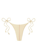 Front view of Palma bottom in Champagne Denim with center seam and adjustable side tie strings on white background