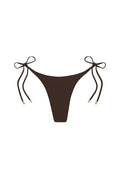 Front of Palma Bottom in espresso, low-rise high-cut bikini with side tie strings and gold-tipped ends on white background