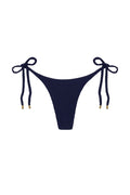 Front view of Palma Bottom showcasing high-cut leg, side tie strings, and midnight crinkle texture on white background