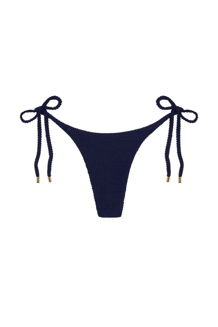 Front view of Palma Bottom showcasing high-cut leg, side tie strings, and midnight crinkle texture on white background