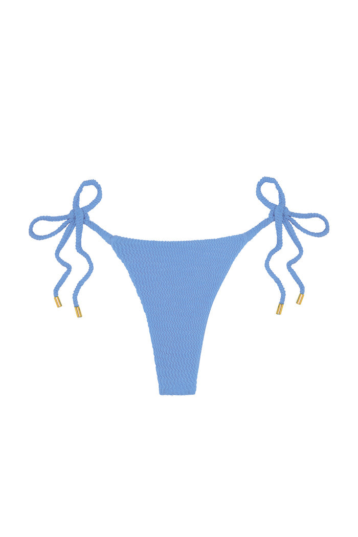 Front view of Palma Thong in Azure Crinkle showcasing textured crinkle fabric and tie-side ropes with gold-capped ends on white background