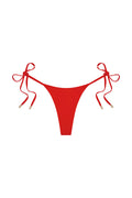 Flat lay Palma Thong in Chili Pepper showing thong cut, adjustable side ties with gold tips on white background