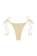 Front view of Palma Thong bikini bottom showing ivory geometric print, tie sides with gold-tipped ends on white background
