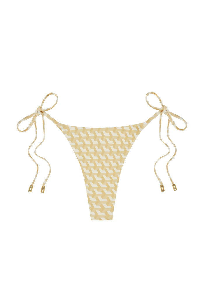 Front view of Palma Thong bikini bottom showing ivory geometric print, tie sides with gold-tipped ends on white background