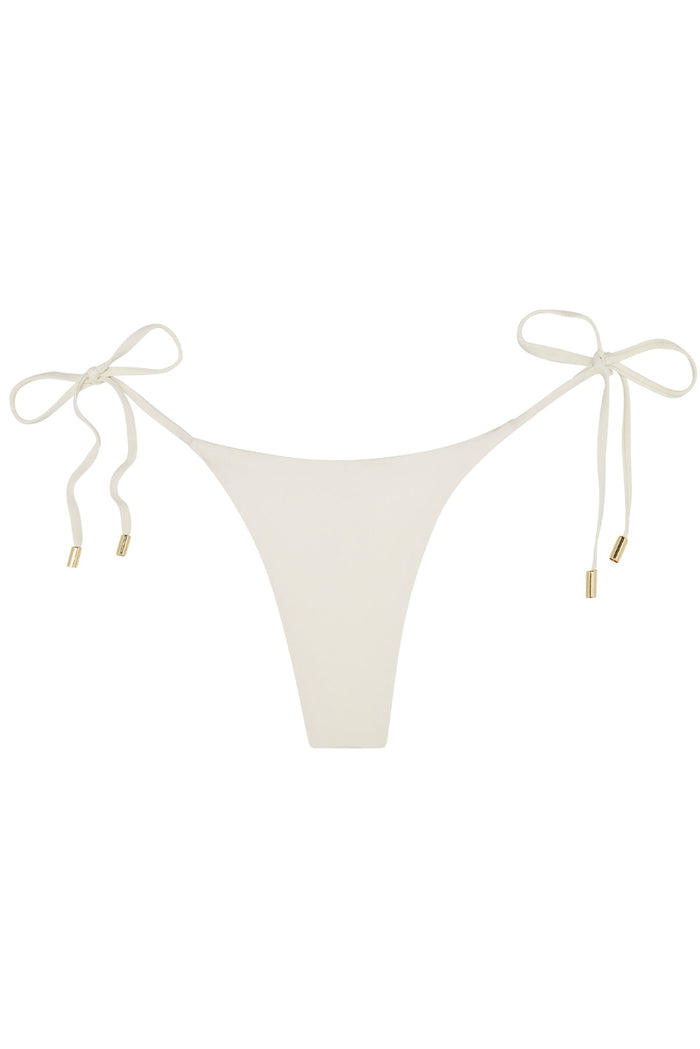 Ivory tie-side bikini bottom with narrow front and gold-tipped side ties.