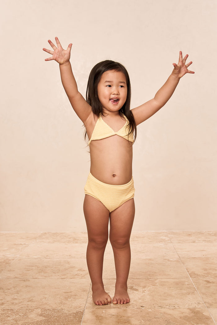 Front view of Palma top and Seychelles bottom kids set showcasing honey crinkle texture on a neutral studio background