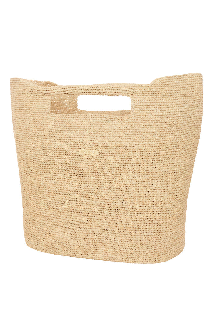 Front close-up of Paloma Bag - Large showcasing hand‑crocheted straw texture, cutout handles and gold MONDAY logo on white background