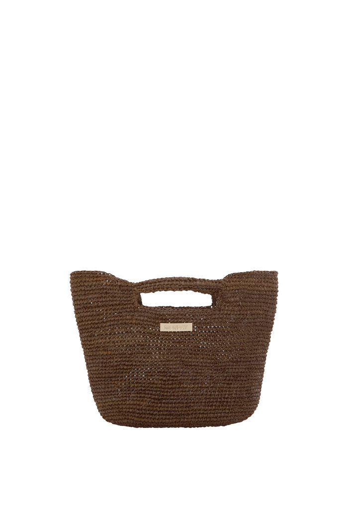 Front view of Paloma Mini Bag in espresso showing hand-crocheted raffia, cutout handles and gold logo plaque