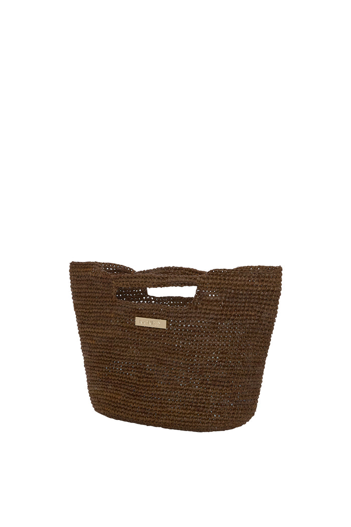 Front view of Mini Paloma bag in Espresso showcasing hand-crocheted raffia texture, cutout handles, and gold logo plate on white background