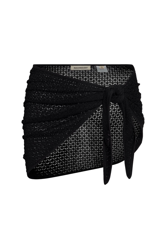 Front view of Paris sarong in black lace crochet showcasing a side tie knot and ruched wrap detail on a white background