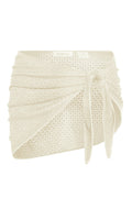 Close-up side view of Paris sarong showcasing ivory crochet lace wrap with tie on white background