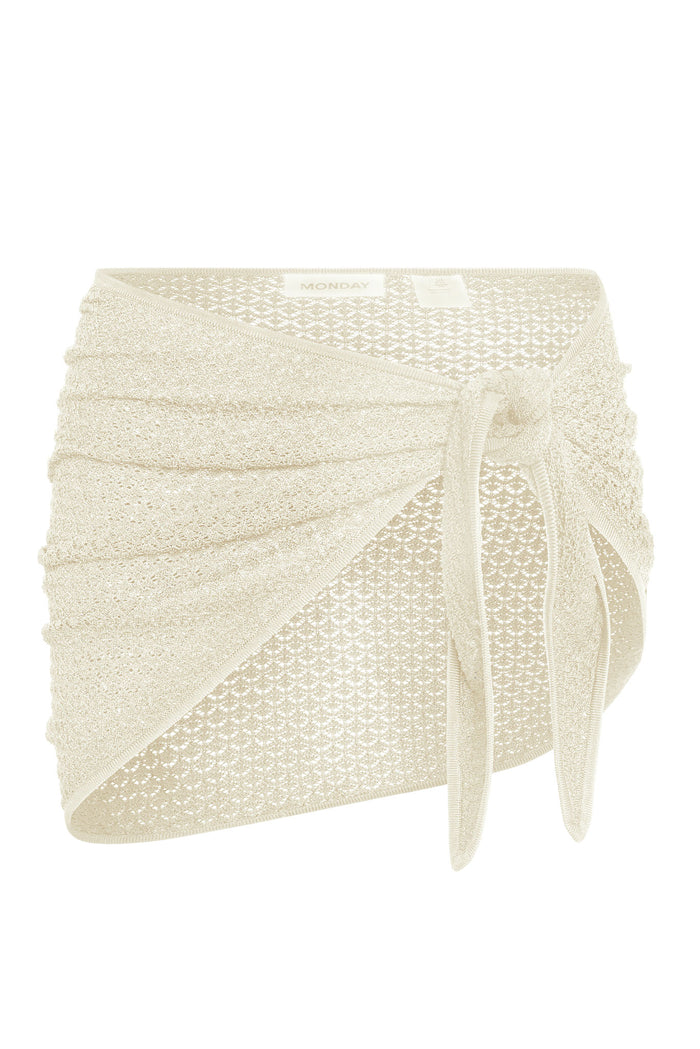 Close-up side view of Paris sarong showcasing ivory crochet lace wrap with tie on white background