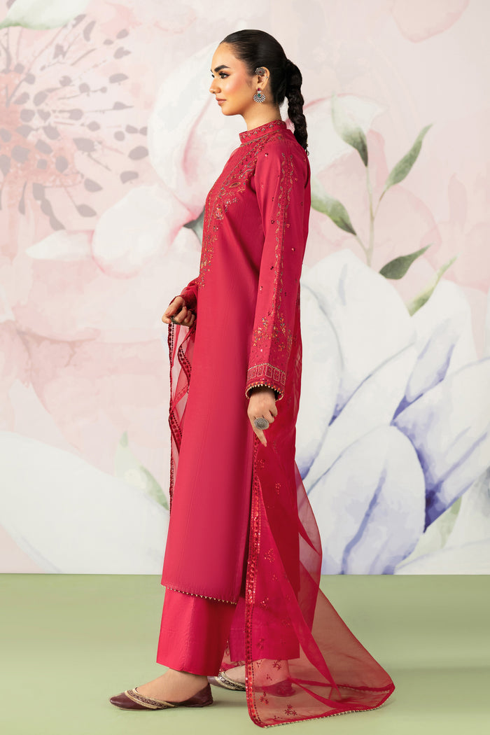 Side standing view showing red straight cut shirt with neat trouser fit and embroidered dupatta semi formal dress