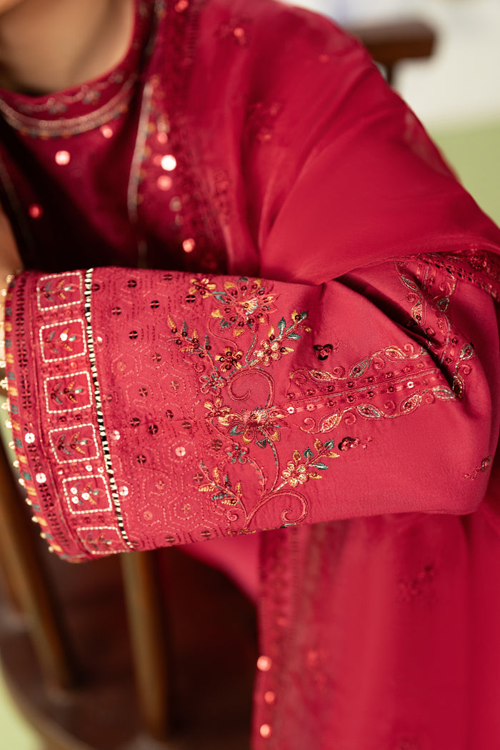 Close up of sleeve embroidery border and tilla lace cuff on Paro red pima lawn shirt