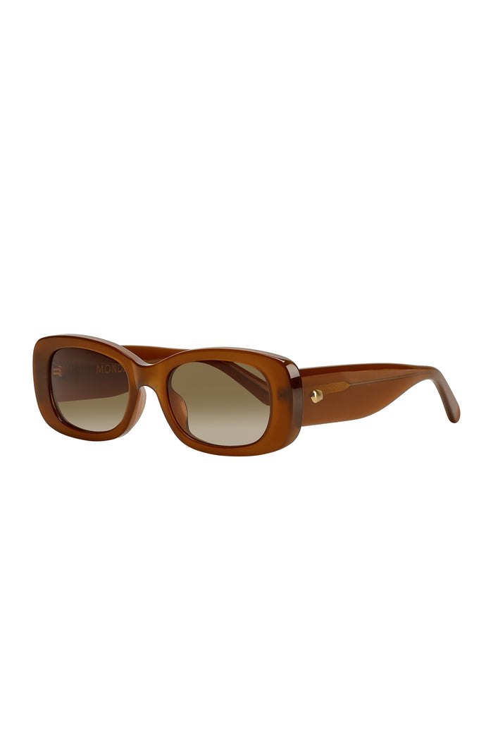 Three-quarter front view of Piana sunglasses in brown acetate showcasing rectangular gradient brown lenses and gold rivet on temple on white background