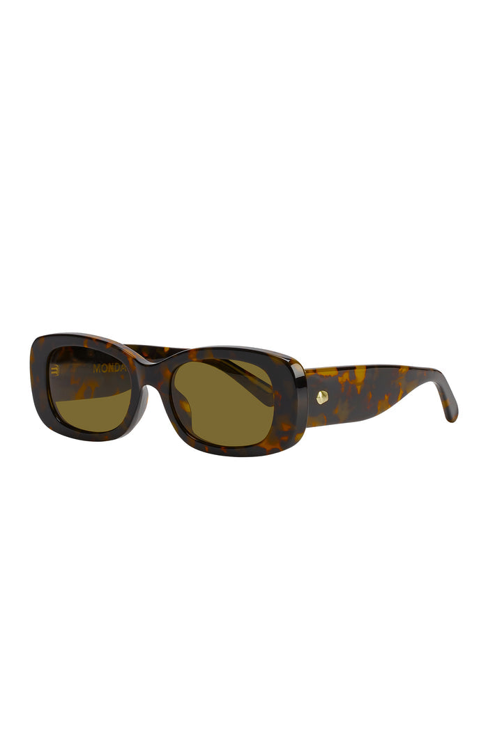 Tortoiseshell rectangular sunglasses with olive lenses, chunky temples and gold stud hinge; visible text on left lens: MONDA