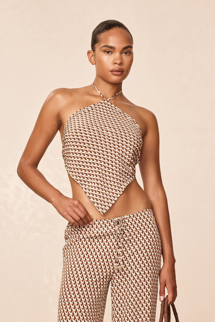 Front view of Prato Top Husk Geo Silk showcasing halter handkerchief silhouette and brown geometric print on beige studio background