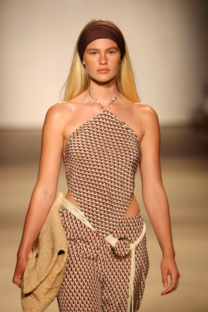 Front view of Prato Top Husk Geo Silk showing brown-and-cream geometric silk halter with halter tie on model against a neutral runway background