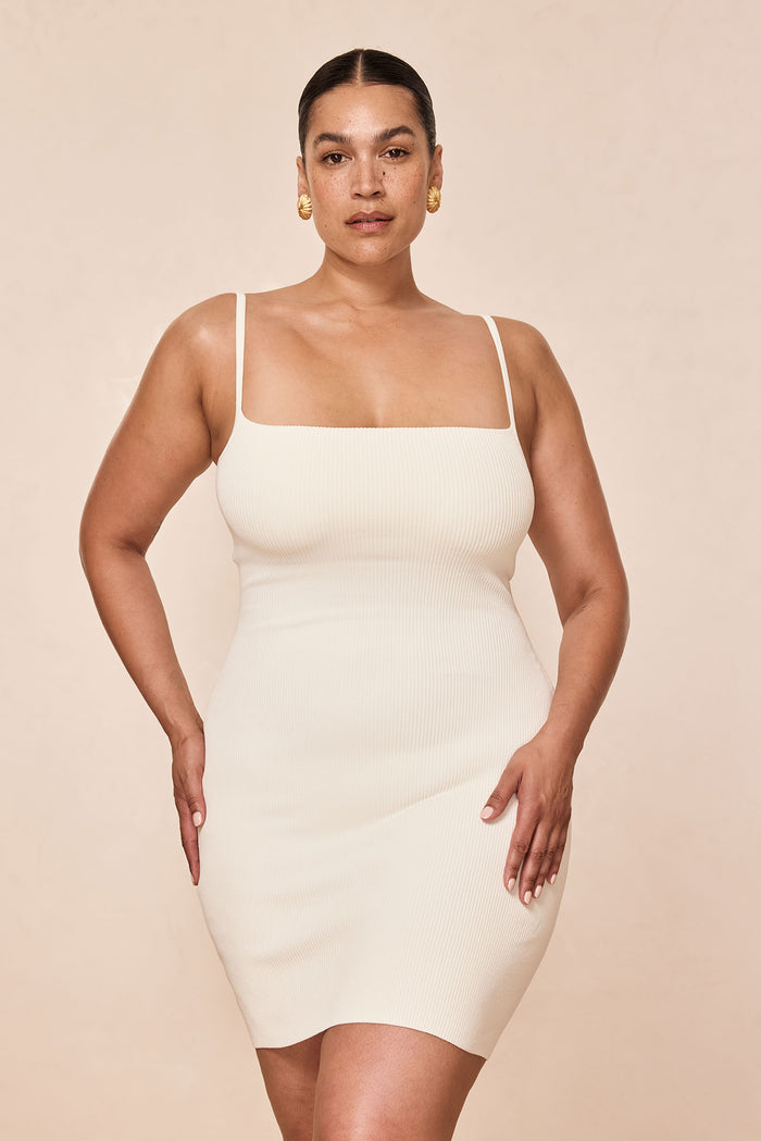 Front view of Provence Mini Dress in ivory knit rib showing square neckline, thin straps, and fitted bodycon silhouette