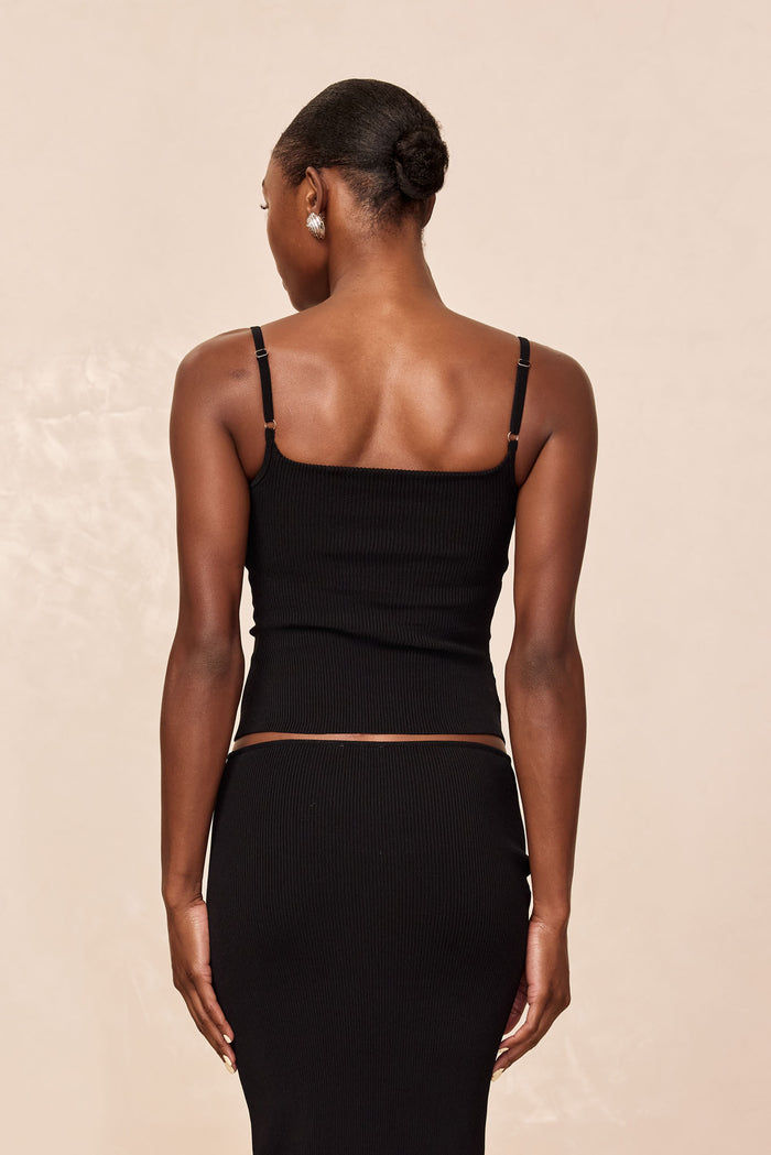 Rear view of Provence Top, Black Knit Rib, showing ribbed texture, adjustable thin straps, and cropped square back on model