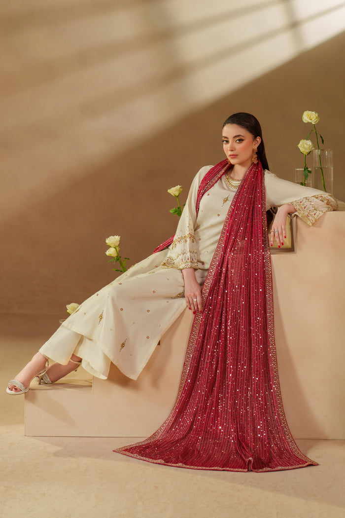 Creative angle of NAQSHI Rabeel luxury pret outfit in off-white with net dupatta, ready to wear for formal evenings and celebration moments