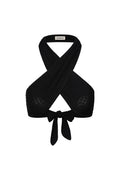 Front view of Ramatuelle Top in Black Lace Crochet showing crossed halter straps, wrap tie front and lace texture on white